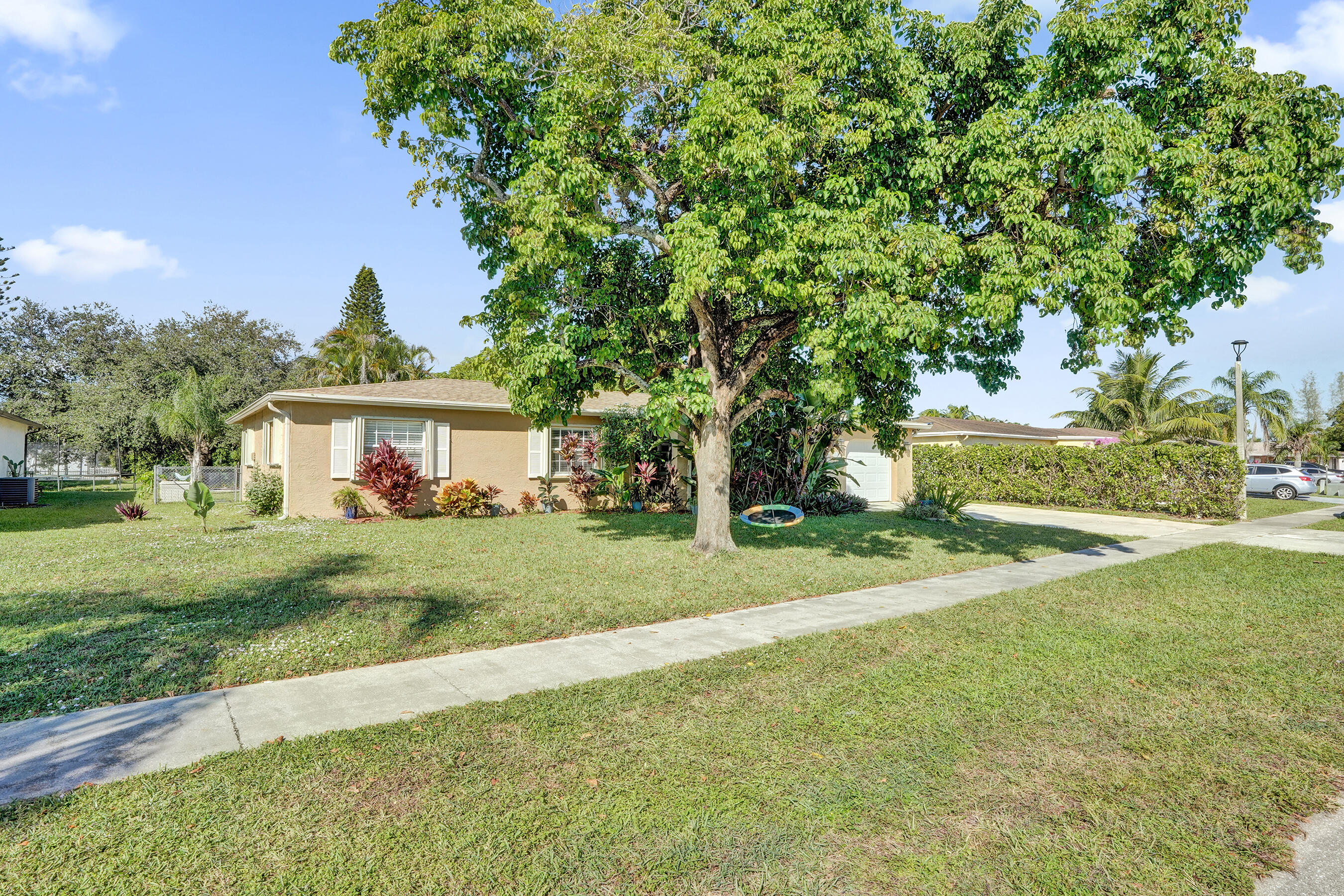 22335 Boulder Street Boca Raton, FL 33428 - Photo 2 of 36 a view of a house with a yard