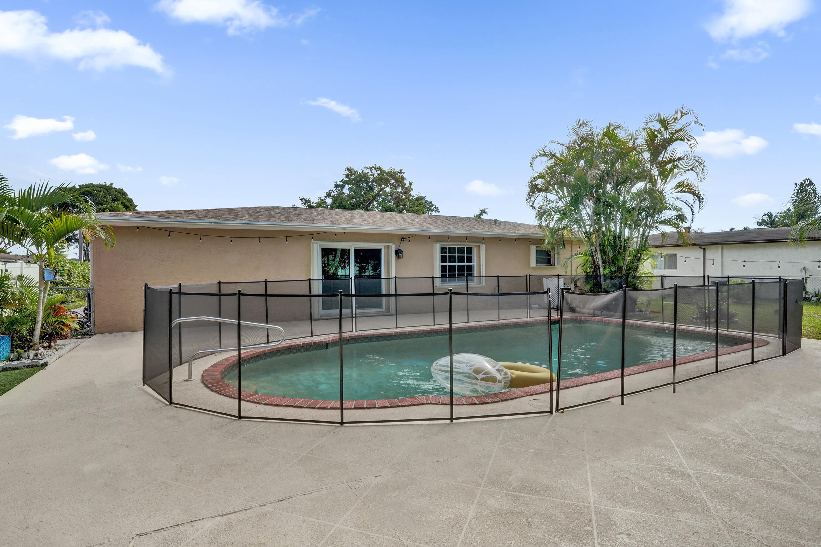22335 Boulder Street Boca Raton, FL 33428 - Photo 25 of 36 a view of a house with a patio