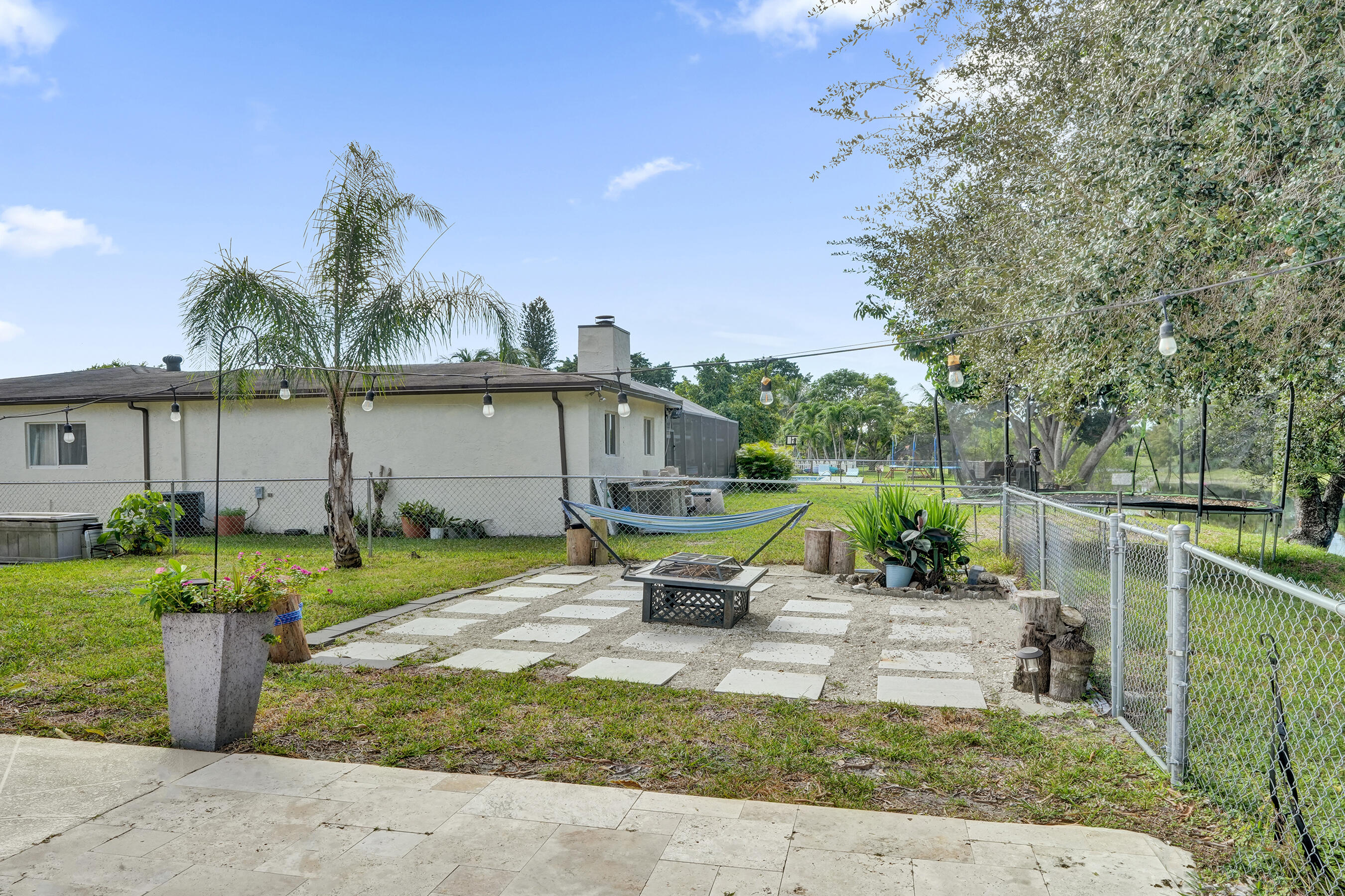 22335 Boulder Street Boca Raton, FL 33428 - Photo 29 of 36 a view of a house with a patio