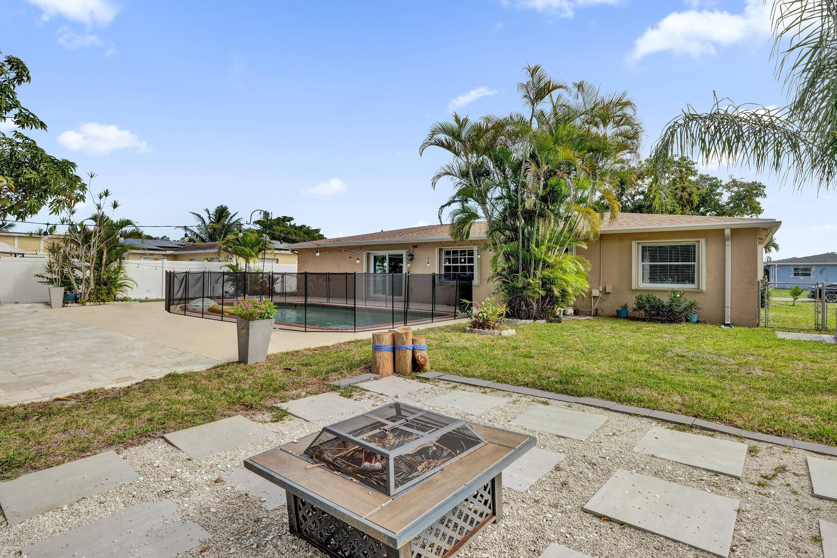 22335 Boulder Street Boca Raton, FL 33428 - Photo 31 of 36 a front view of a house with garden