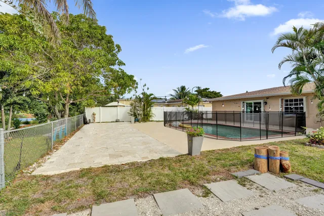 a view of a swimming pool with a patio