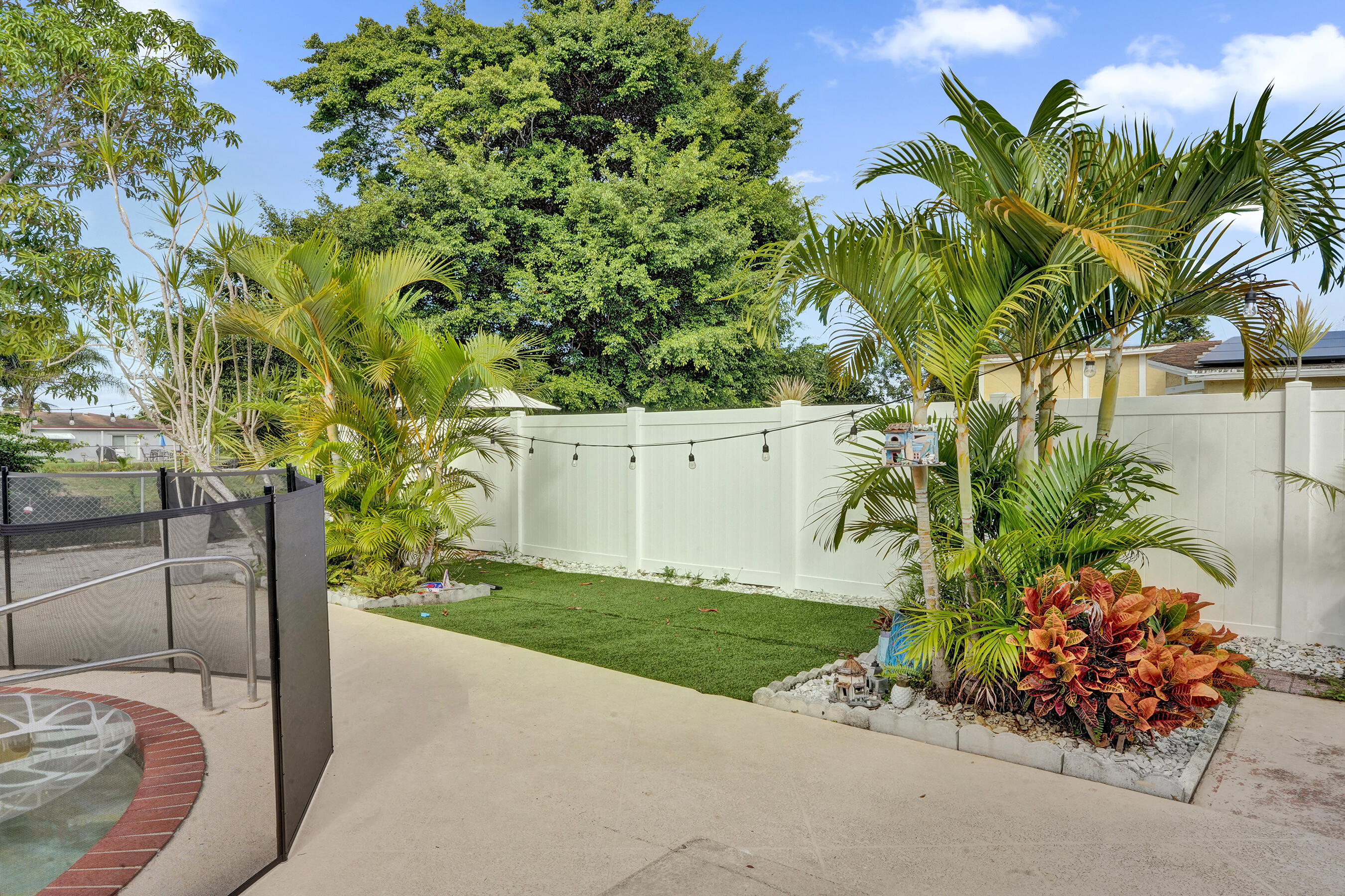 22335 Boulder Street Boca Raton, FL 33428 - Photo 34 of 36 a view of a garden with a bench