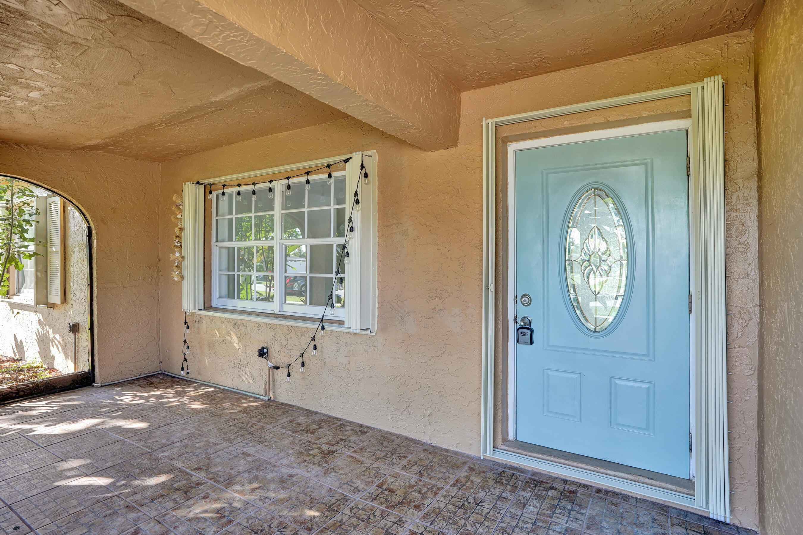 22335 Boulder Street Boca Raton, FL 33428 - Photo 4 of 36 an empty room with a window and mirror