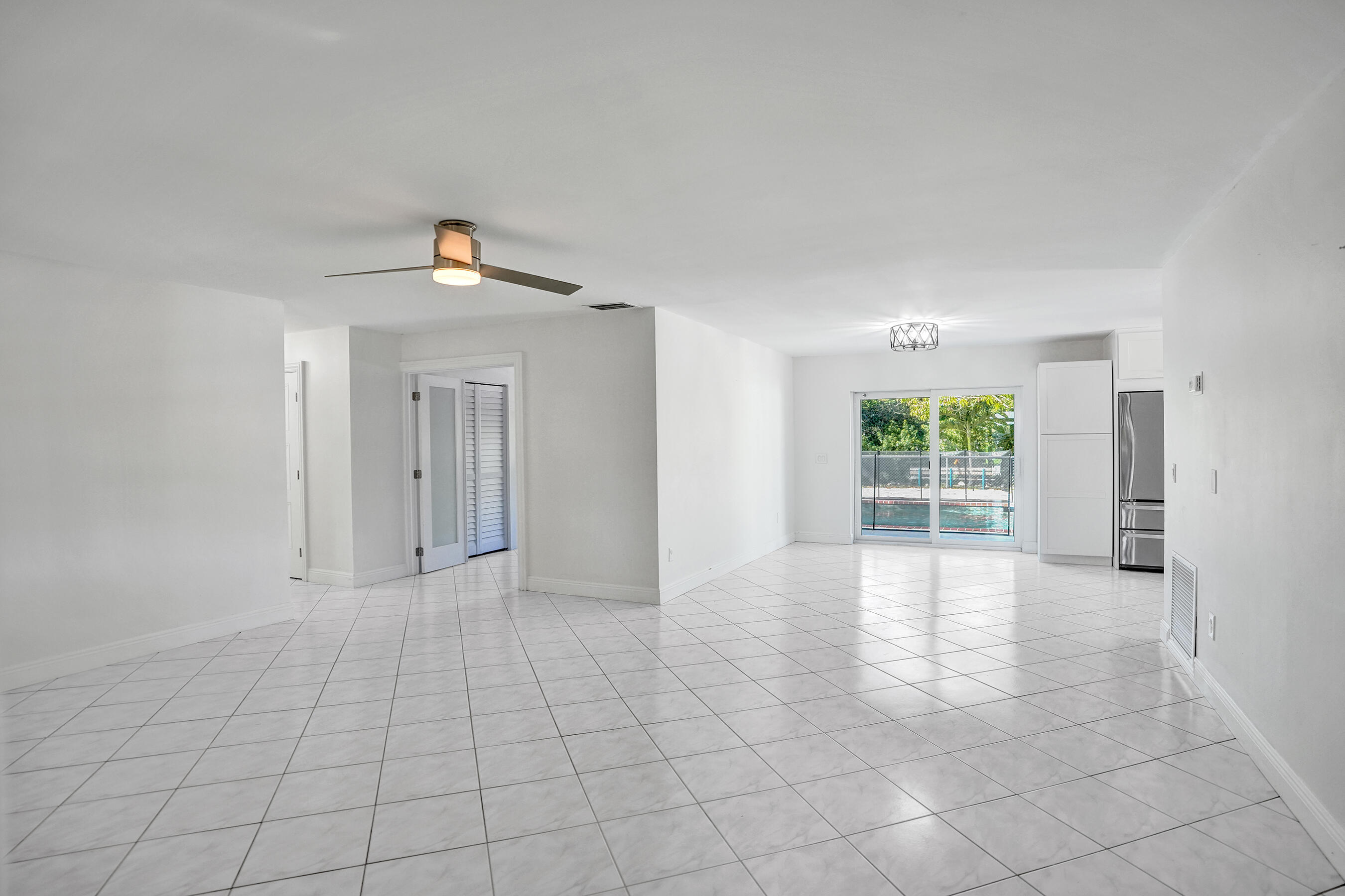 22335 Boulder Street Boca Raton, FL 33428 - Photo 5 of 36 a view of an empty room with a window