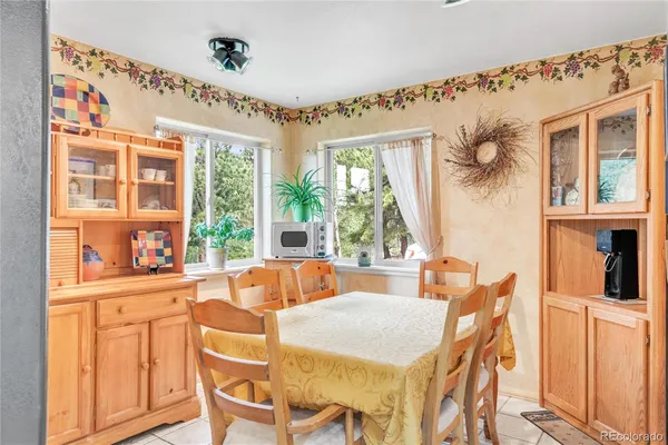 a kitchen with a white stove top oven and white cabinets