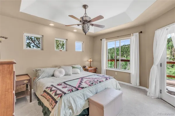 a bedroom with a large bed and a window