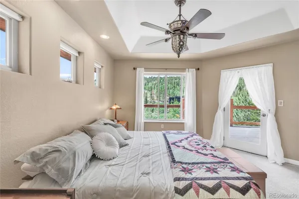 a bedroom with a bed and a couch