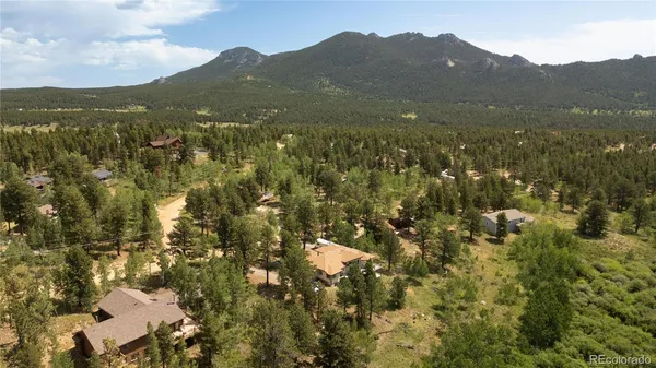 a aerial view of a house with a yard