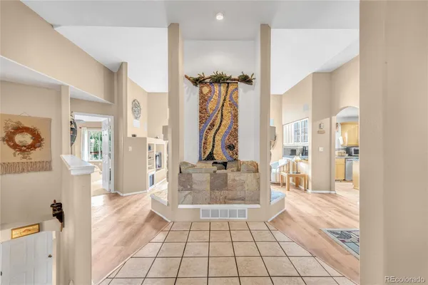 a view of an entryway with wooden floor