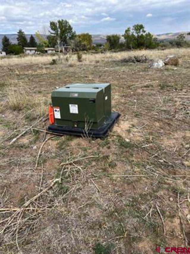 1266 Southwest 11th Avenue Cedaredge, CO 81413 - Photo 3 of 10 a view of lake with mountain