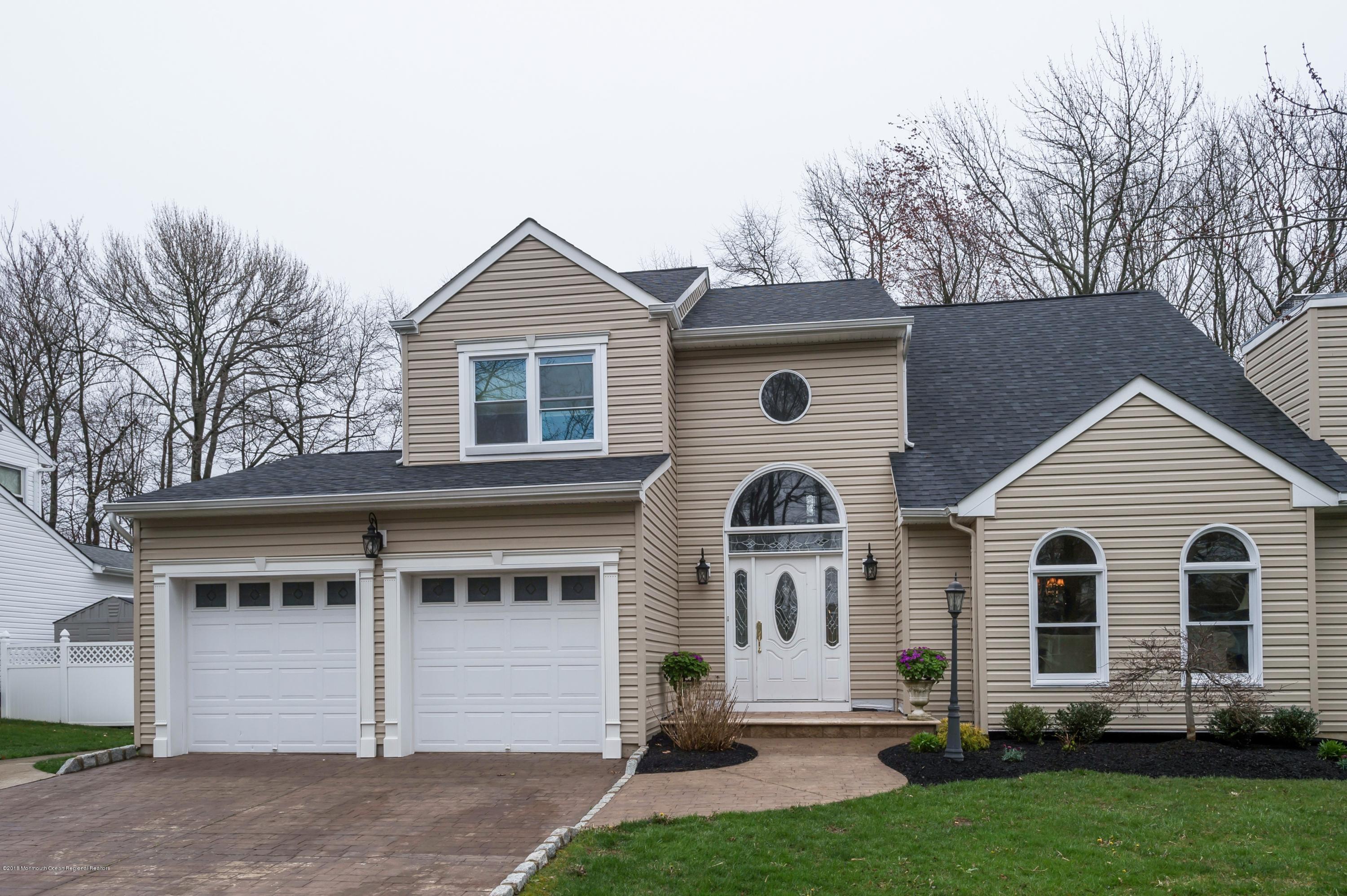 17 Walnut Court Matawan, NJ 07747 - Photo 1 of 17 a front view of a house with a yard