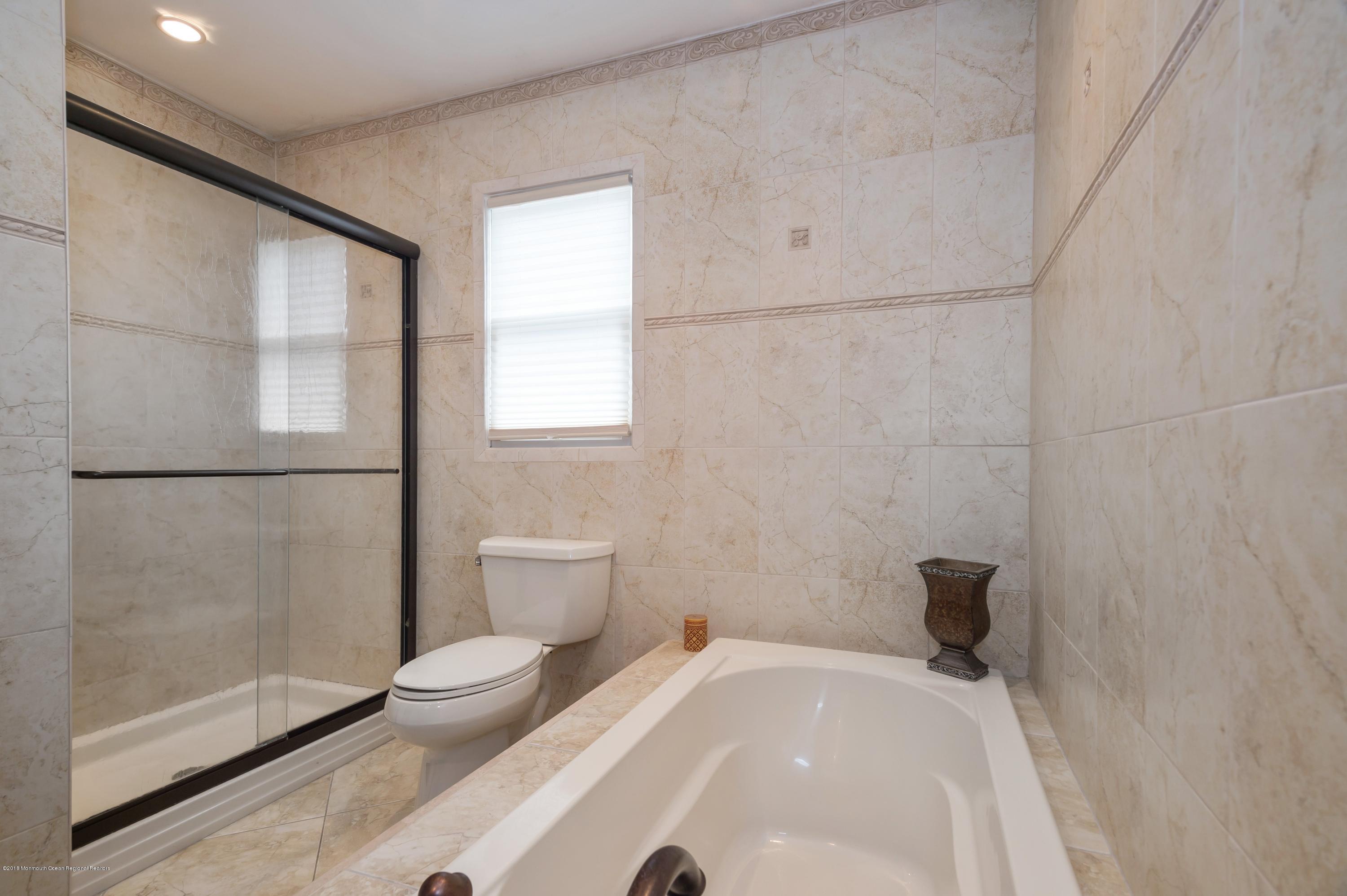 17 Walnut Court Matawan, NJ 07747 - Photo 14 of 17 a bathroom with a toilet and a shower