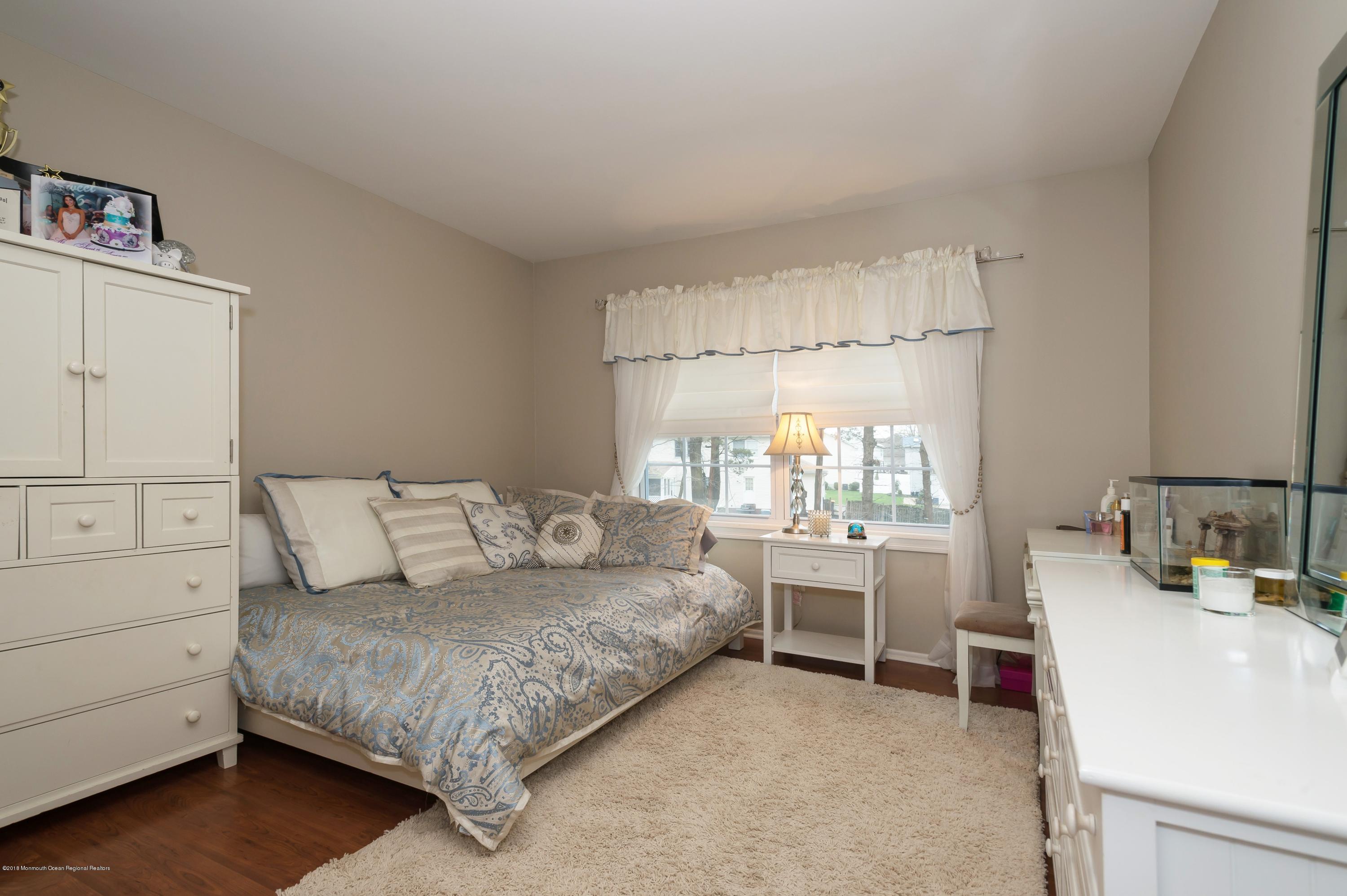17 Walnut Court Matawan, NJ 07747 - Photo 15 of 17 a living room with furniture and a table