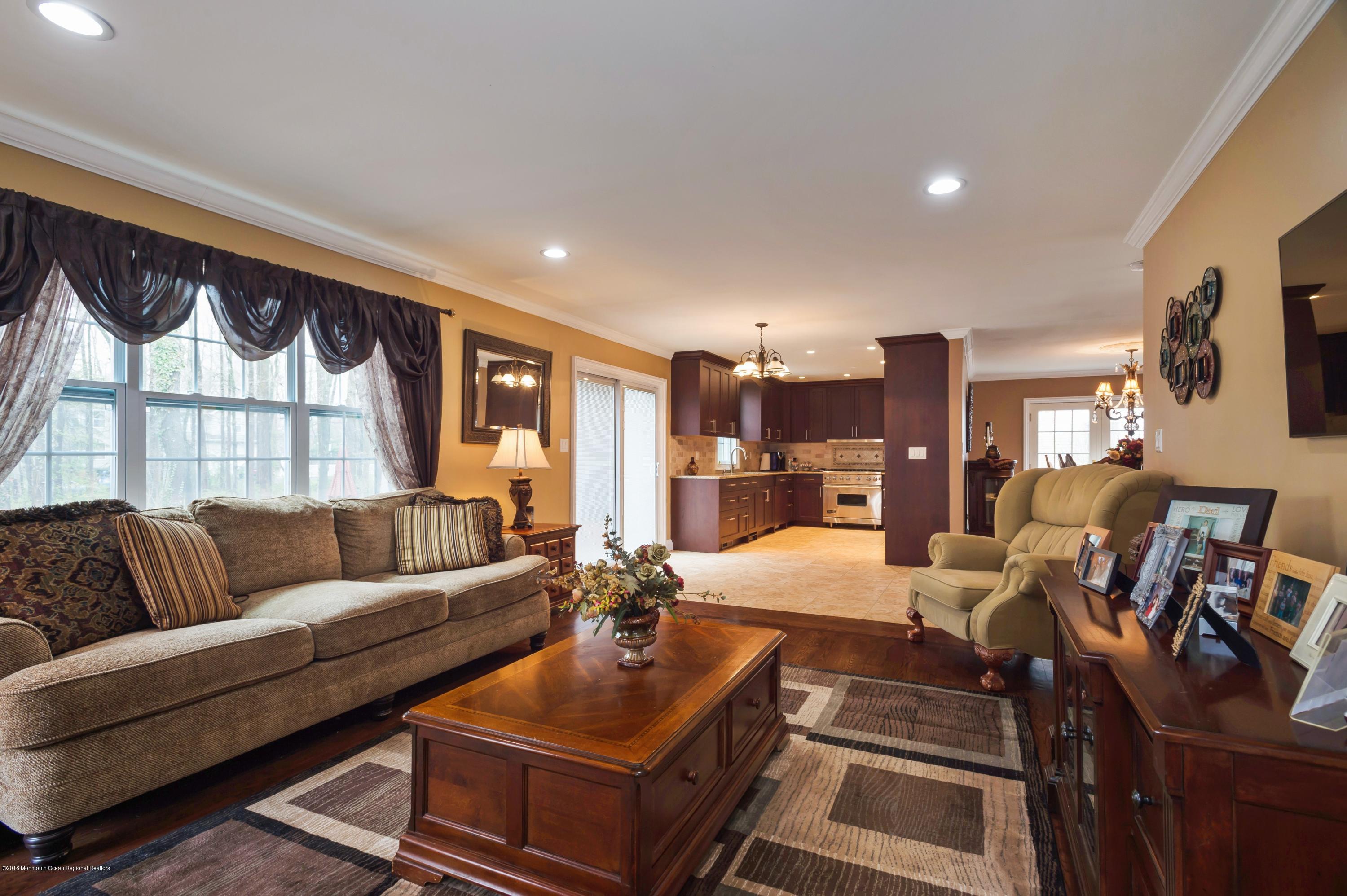 17 Walnut Court Matawan, NJ 07747 - Photo 7 of 17 a living room with furniture and a large window
