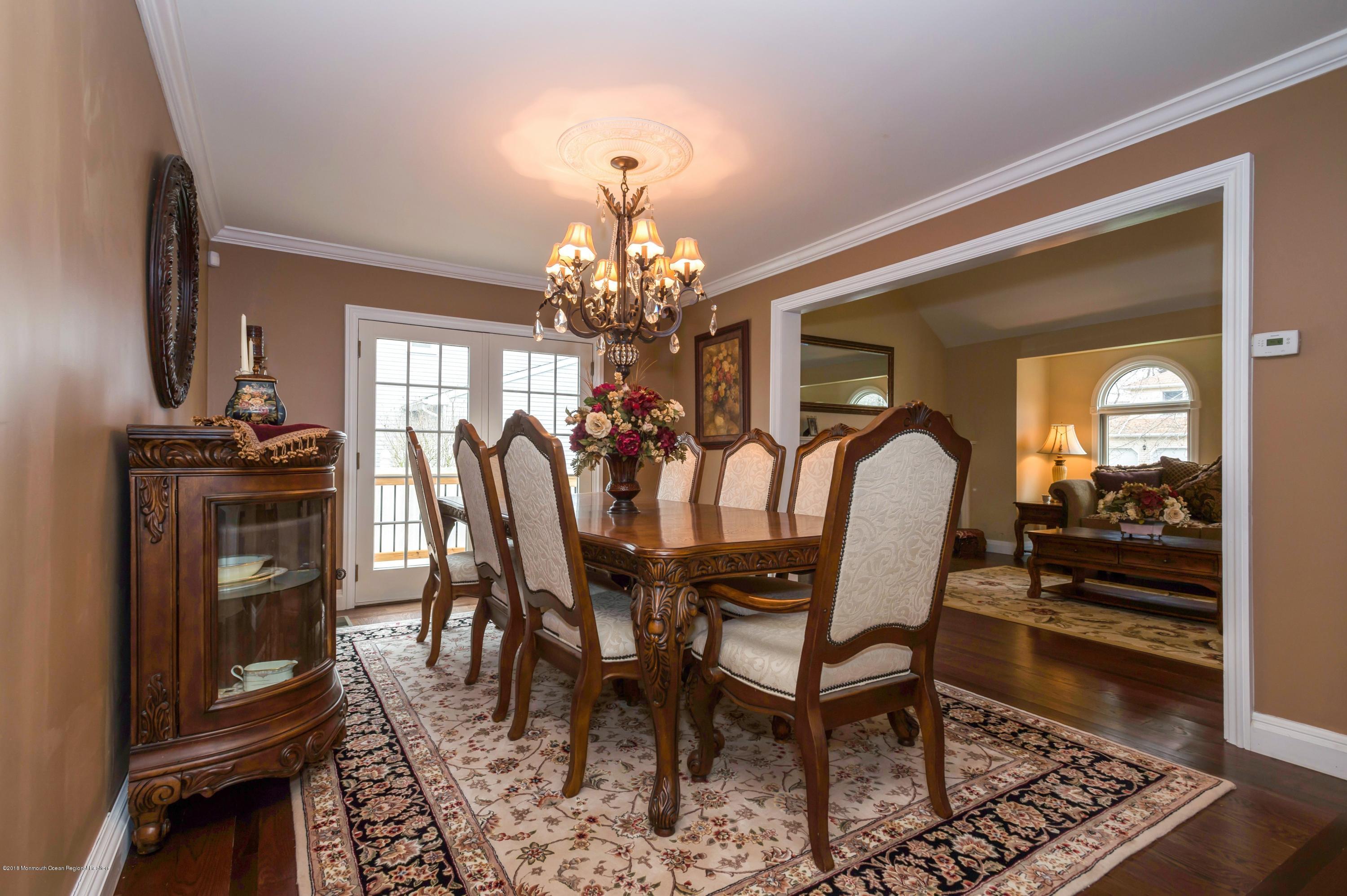 17 Walnut Court Matawan, NJ 07747 - Photo 8 of 17 a view of a dining room with furniture and chandelier