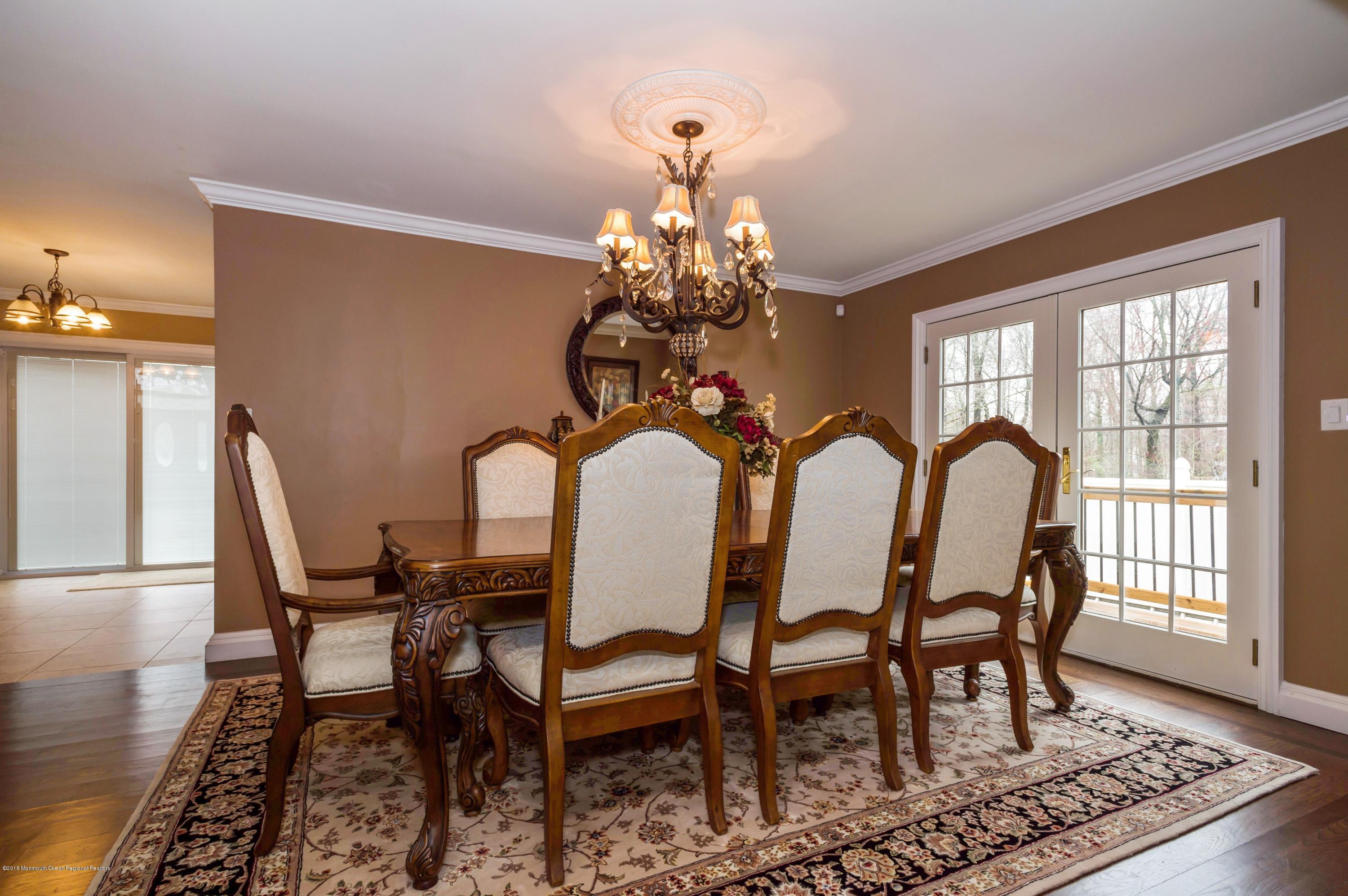 17 Walnut Court Matawan, NJ 07747 - Photo 9 of 17 a view of a dining room with furniture window and wooden floor
