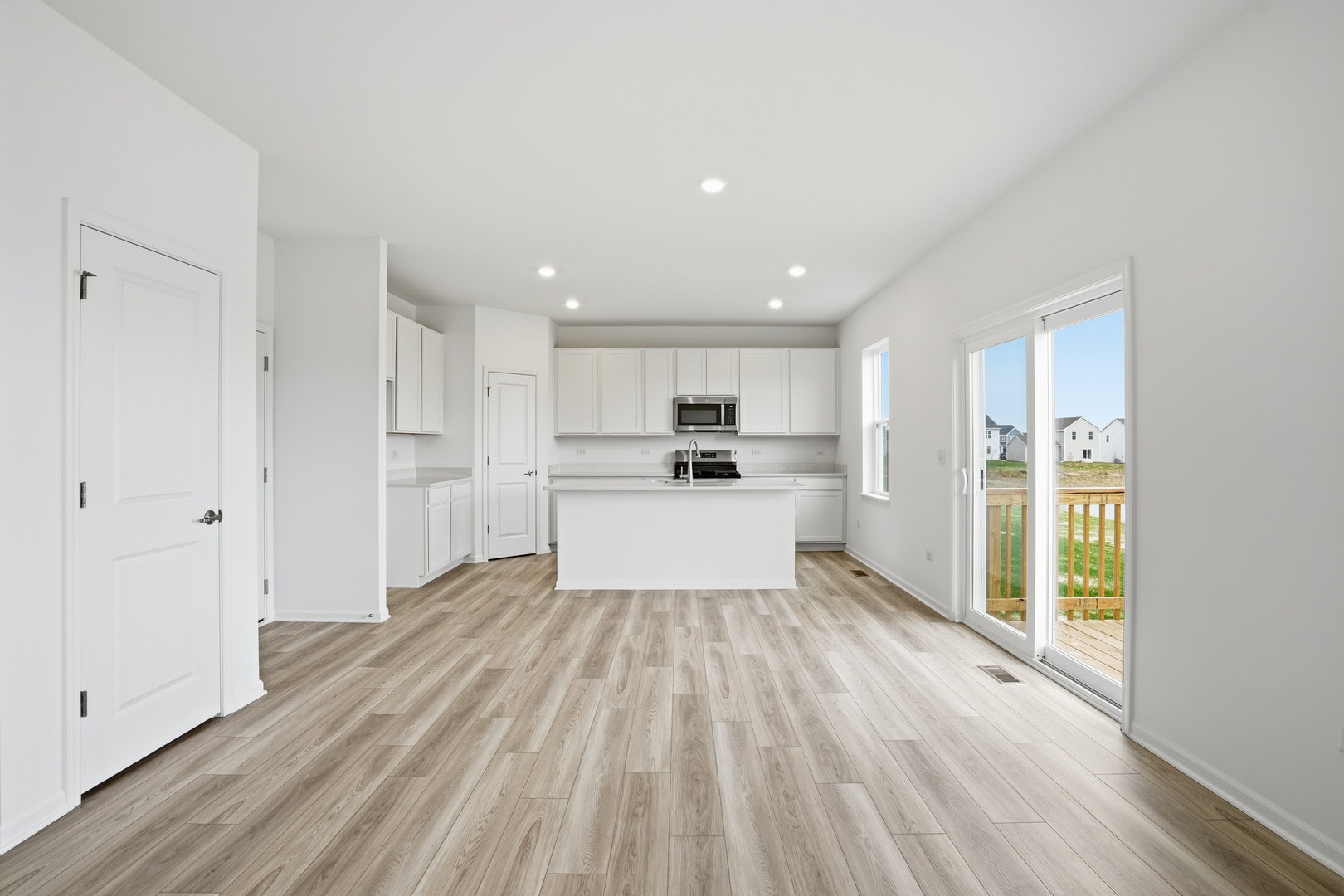 342 Danforth Drive Oswego, IL 60543 - Photo 6 of 21 a view of a kitchen with wooden floor