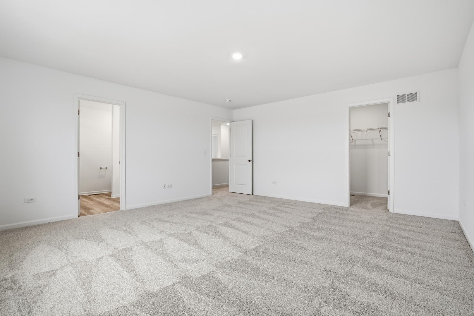 342 Danforth Drive Oswego, IL 60543 - Photo 10 of 21 a view of an empty room with wooden floor