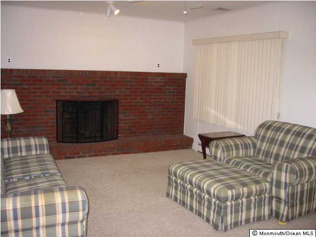 569 Harbor Road Brick, NJ 08724 - Photo 3 of 3 a bedroom with a bed and a couch