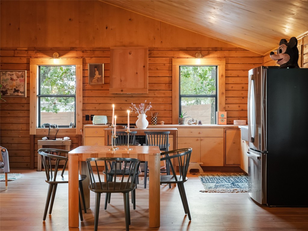 127 Marina Road Smithville, TX 78957 - Photo 14 of 40 a dining room with furniture window and wooden floor