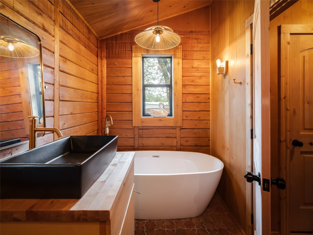 127 Marina Road Smithville, TX 78957 - Photo 18 of 40 a bathroom with a granite countertop sink toilet and shower