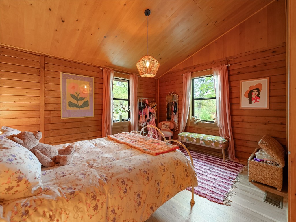 127 Marina Road Smithville, TX 78957 - Photo 19 of 40 a bed room with a bed closet and a window