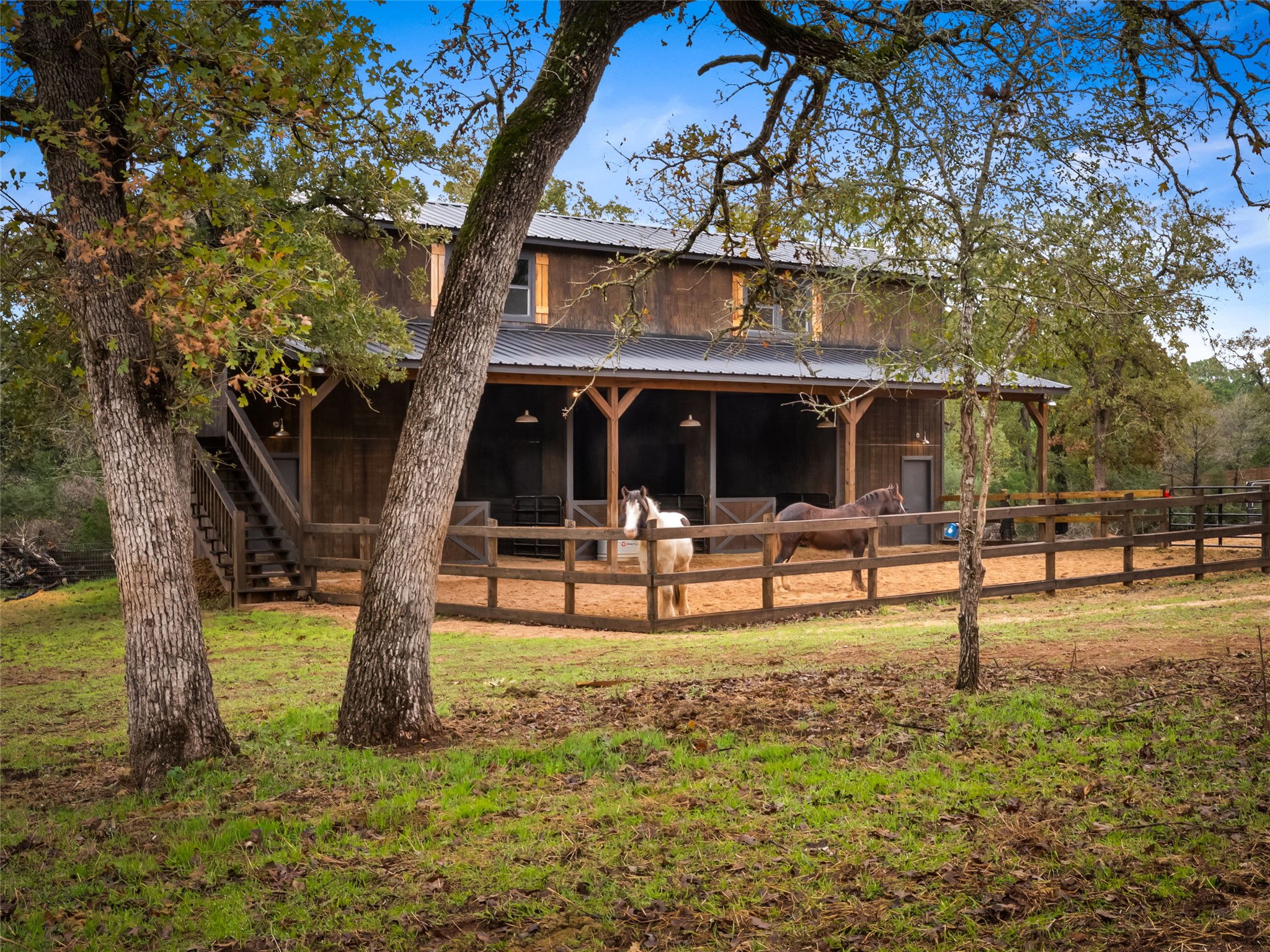 127 Marina Road Smithville, TX 78957 - Photo 21 of 40 a view of pool with lawn chairs and large trees