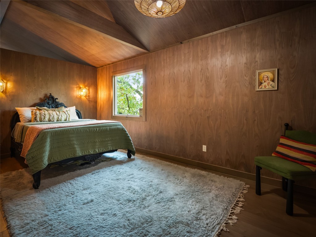 127 Marina Road Smithville, TX 78957 - Photo 27 of 40 a bedroom with a bed and a lamp on table