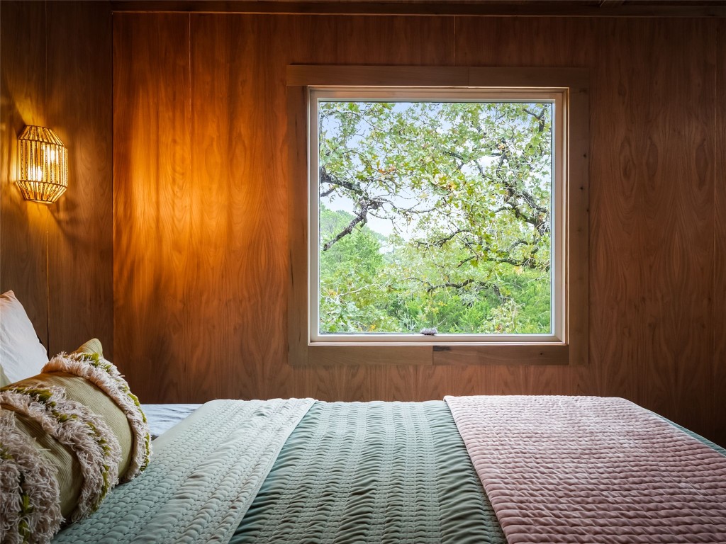 127 Marina Road Smithville, TX 78957 - Photo 28 of 40 a bed sitting in a bedroom next to a window