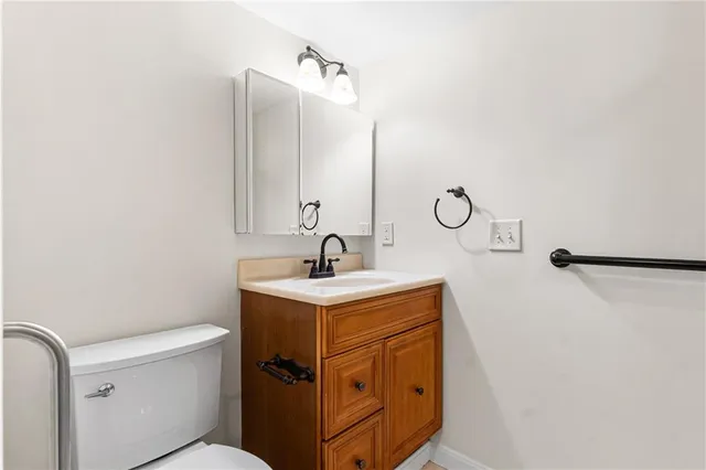 a bedroom with a bed and a potted plant