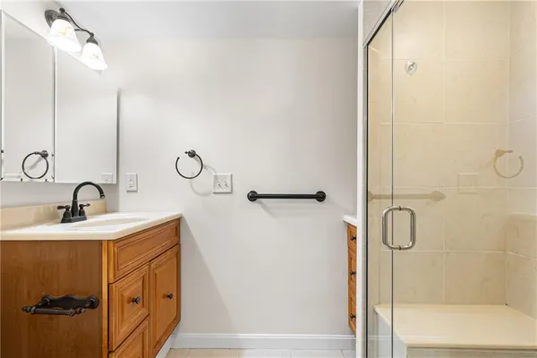 an empty room with a window and a ceiling fan