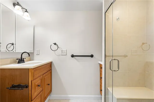 an empty room with a window and a ceiling fan