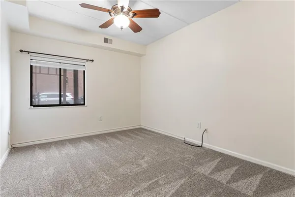 a view of a patio with couches and a potted plant