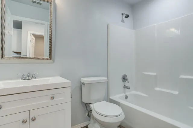 a bathroom with a toilet a sink and a bathtub