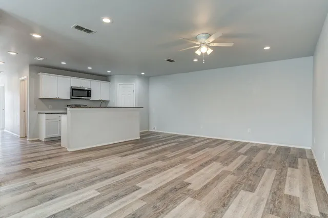 a view of a kitchen with a sink and a microwave