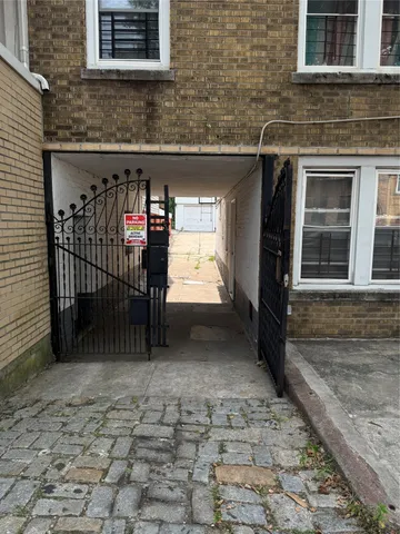 a view of a brick house with an outdoor space