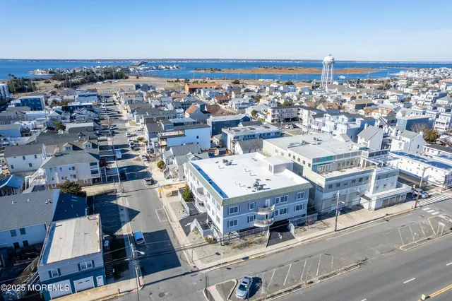 an aerial view of a house with a ocean view