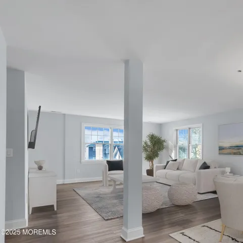 a living room with furniture and view of living room