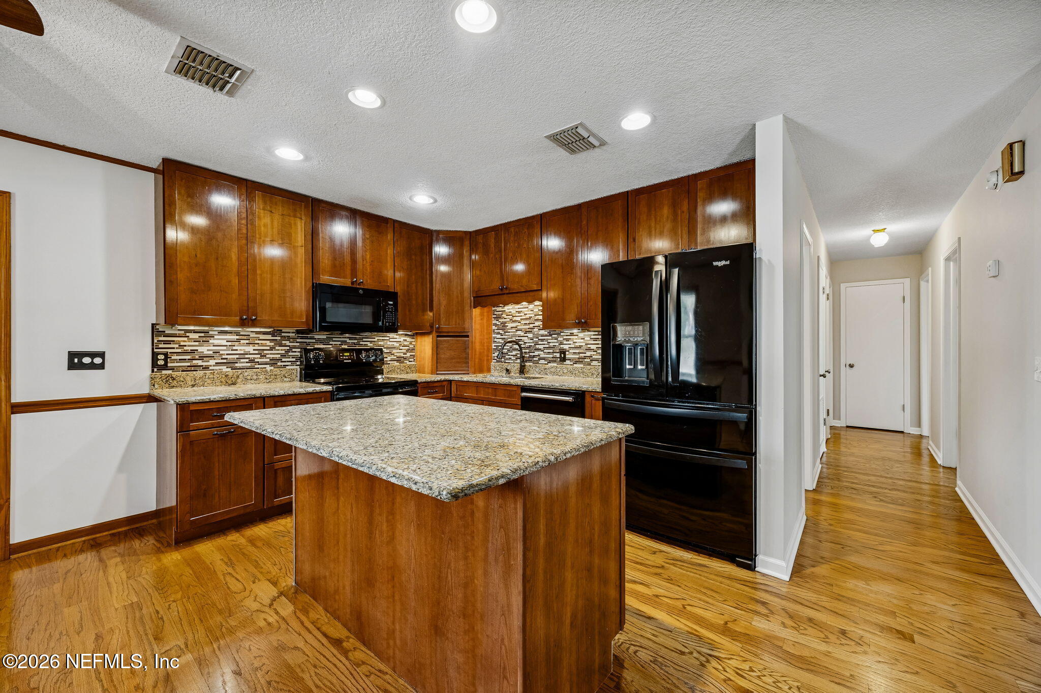 1888 Clemson Road Jacksonville, FL 32217 - Photo 4 of 41 a kitchen with stainless steel appliances granite countertop a refrigerator a sink and a stove