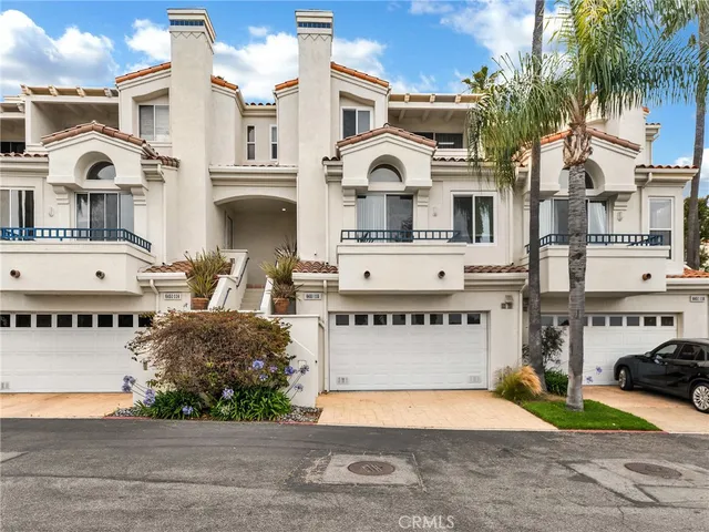 a front view of a building with parking space