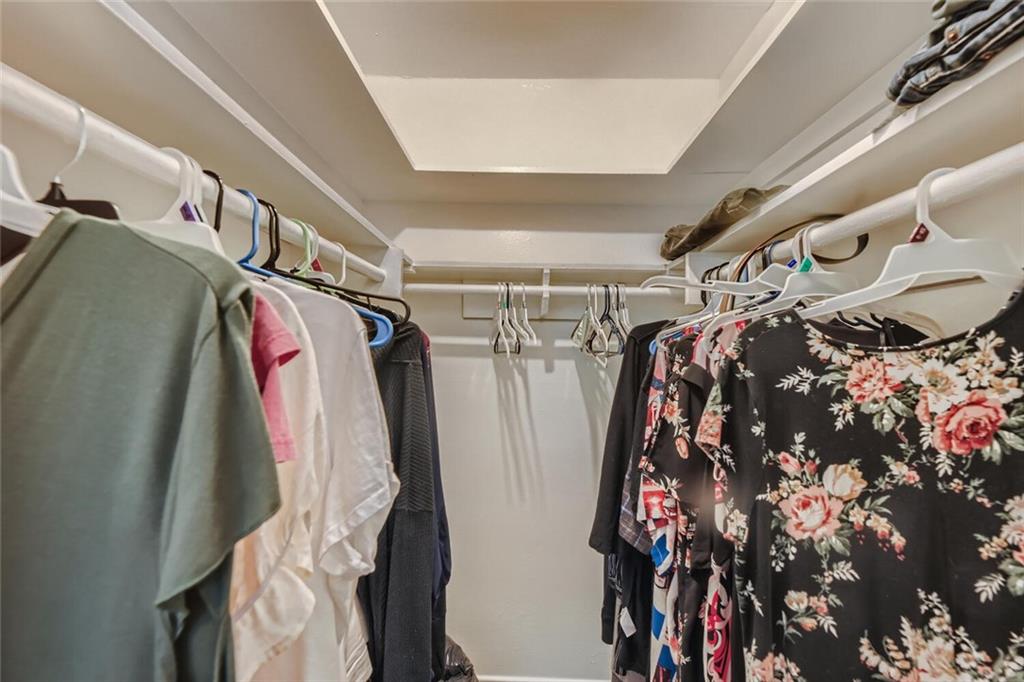 2401 Manor Road, Unit 111 Austin, TX 78722 - Photo 13 of 23 a view of walk in closet with clothes and shoes