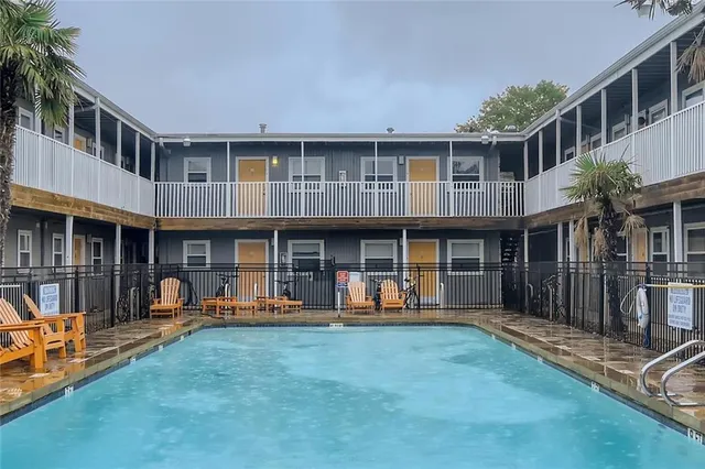 a patio with a table and chairs