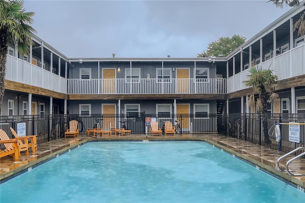 2401 Manor Road, Unit 111 Austin, TX 78722 - Photo 20 of 23 a front view of a house with sitting area and furniture
