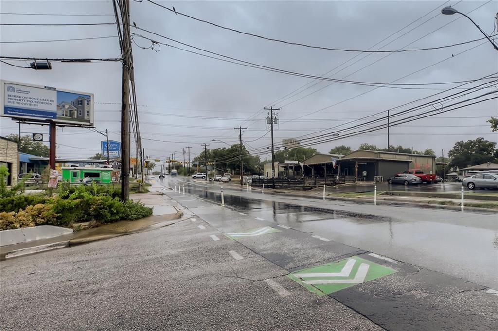 2401 Manor Road, Unit 111 Austin, TX 78722 - Photo 23 of 23 a table and chairs sitting in the middle of a building