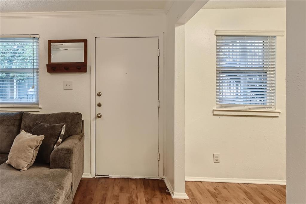 2401 Manor Road, Unit 111 Austin, TX 78722 - Photo 10 of 23 a view of bedroom with furniture and window