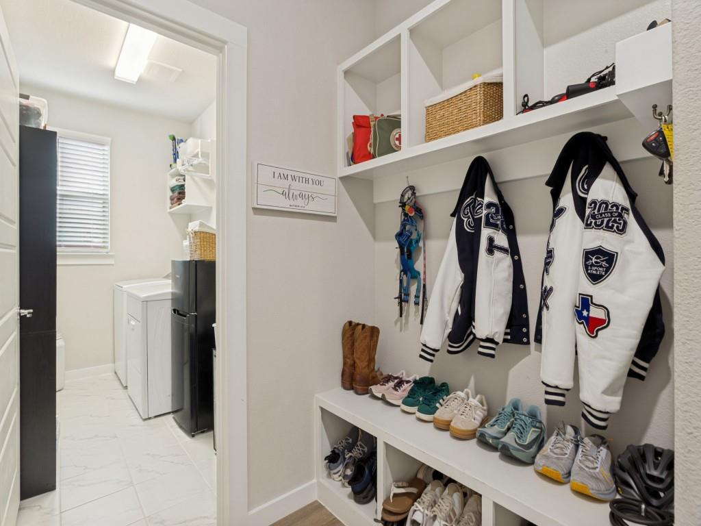 10613 Smiths Bnd Road Fort Worth, TX 76126 - Photo 25 of 29 Mudroom storage system featuring built-in shelving, cubbies, and coat hooks