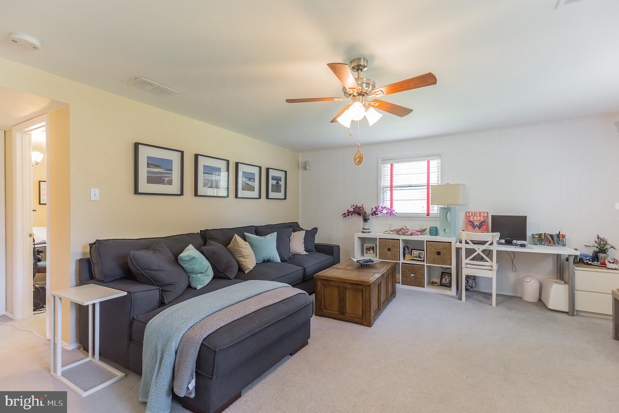 7020 Hadlow Drive Springfield, VA 22152 - Photo 14 of 29 a living room with furniture kitchen view and a window
