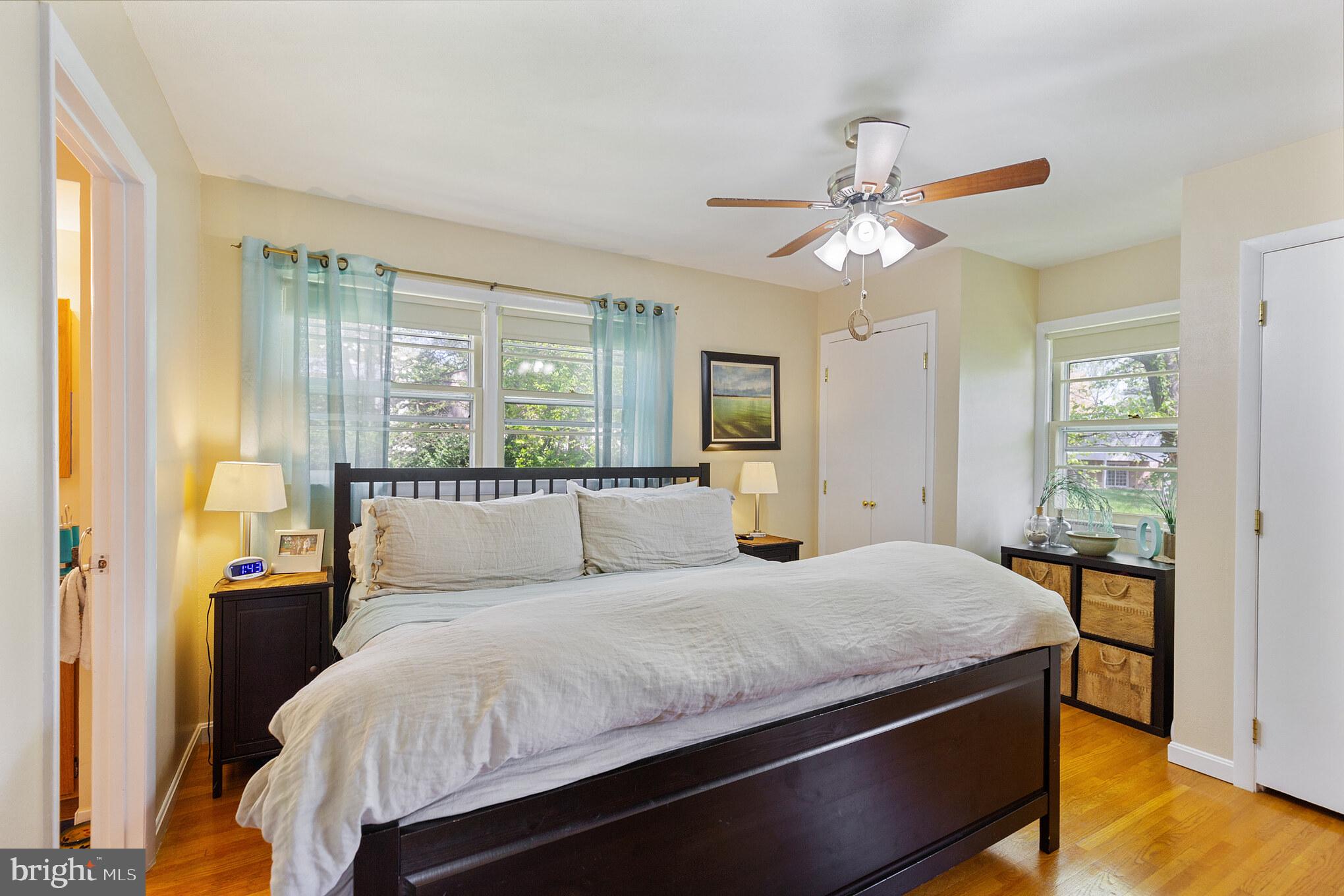 7020 Hadlow Drive Springfield, VA 22152 - Photo 22 of 29 a bedroom with a large bed and a chandelier