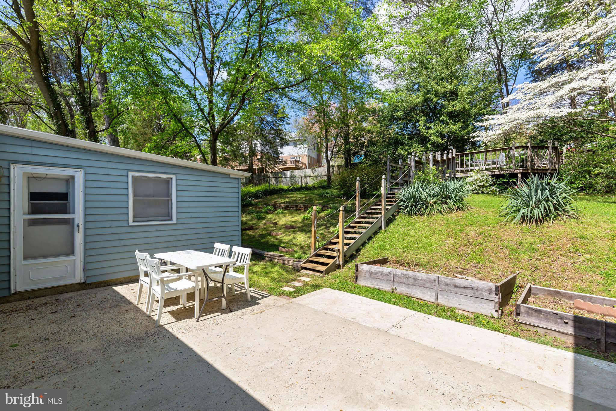 7020 Hadlow Drive Springfield, VA 22152 - Photo 24 of 29 a view of a lake with couches and wooden fence