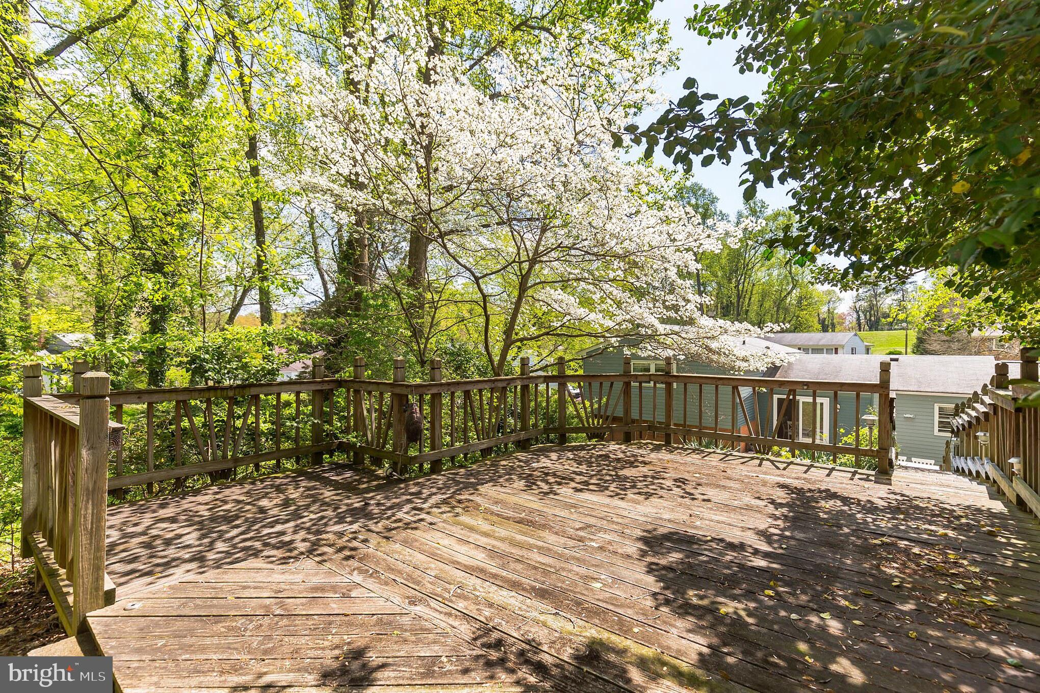 7020 Hadlow Drive Springfield, VA 22152 - Photo 26 of 29 a view of a house with a small yard and wooden fence